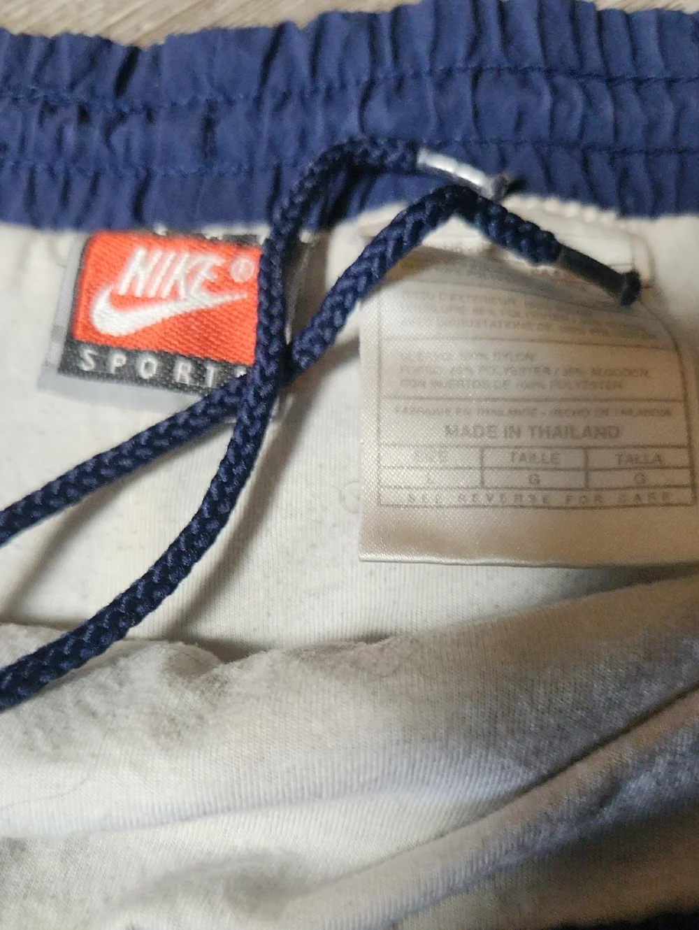Vintage Nike Navy Blue Track Pants with Red Swoosh